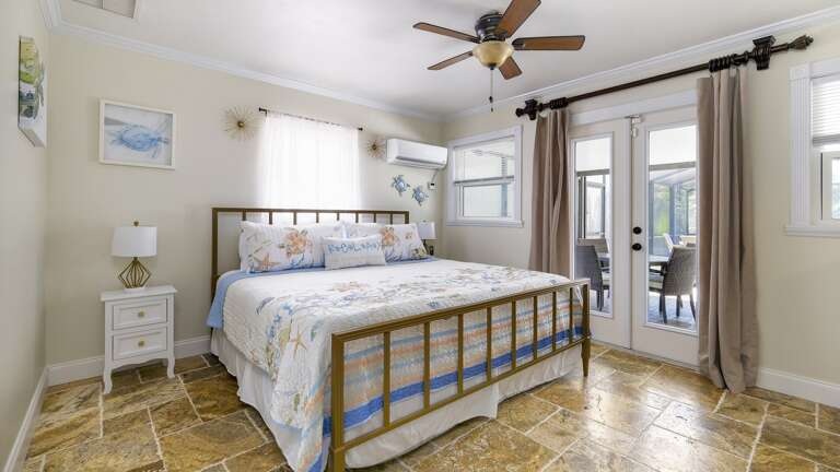 Primary Bedroom with King Bed and Patio Access