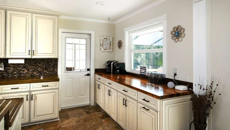 Prep Space with Coffee Bar and View Out to Pool