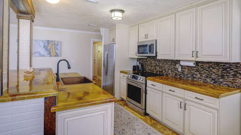 Kitchen has an Island Sink and Serving Space