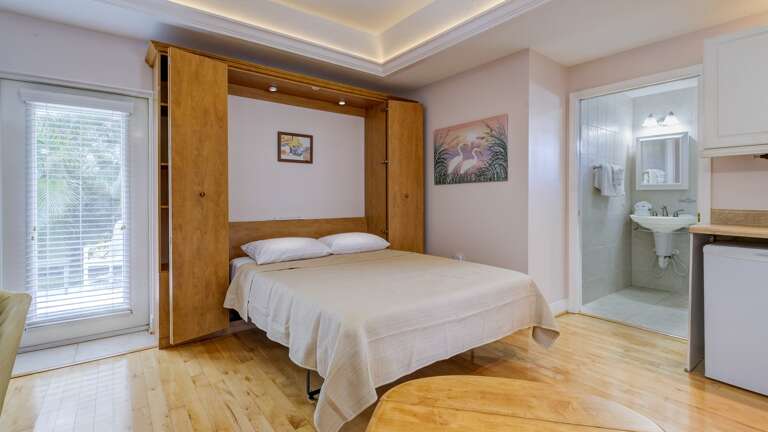 Murphy bed pulls down from cabinet