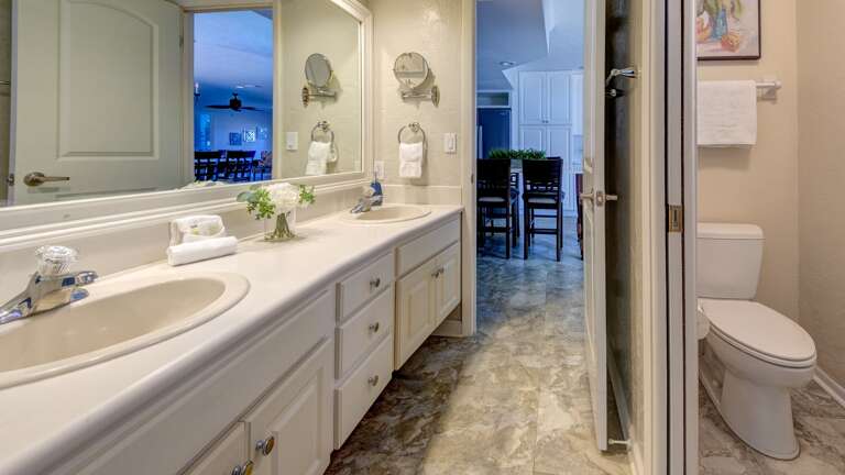 Main Bath with Double Sinks and Private Water Closet