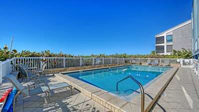 Beachside pool with loungers