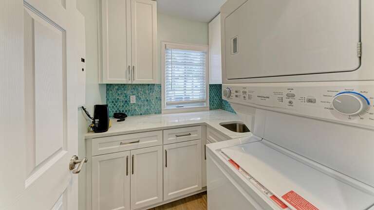 Full Laundry Room with Sink and Storage