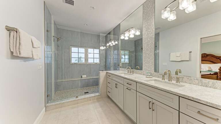 Luxury shower with two heads and sleek built in bench
