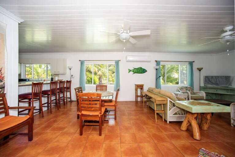 Dining Area and Kitchen with bar seating.