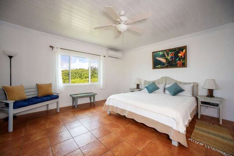 Master bedroom with ten-foot glass slider and spectacular ocean views