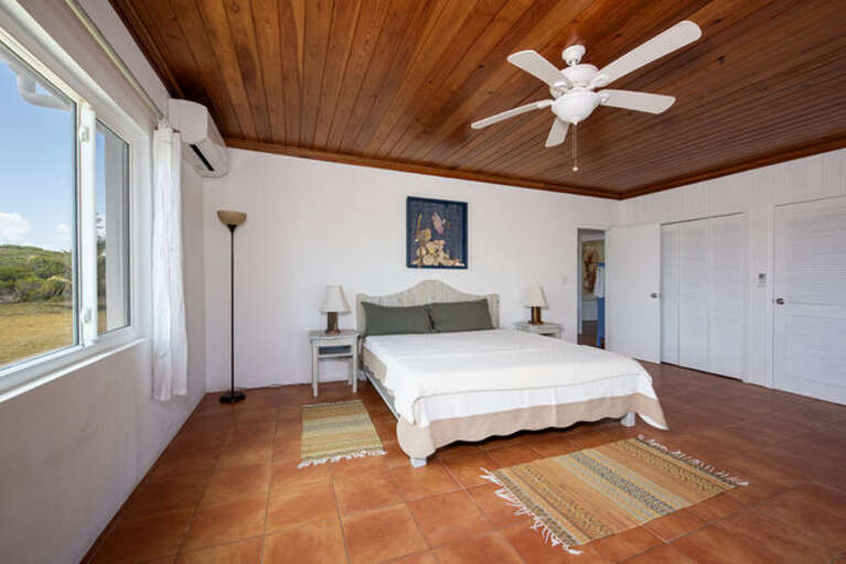 Master bedroom with ten-foot glass slider and spectacular ocean views Master bedroom with ten-foot glass slider and spectacular ocean views