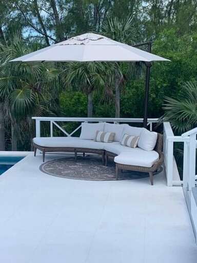 Relax by the pool with covered deck seating Relax by the pool with covered deck seating