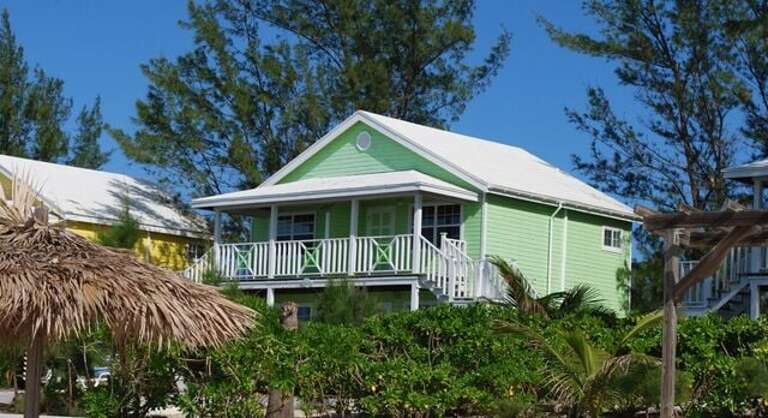 The Green Building with four rooms, two king bedrooms upstairs and 1 double room and 1 king/single room downstairs.  Every room has an en-suite bath and an ocean view.