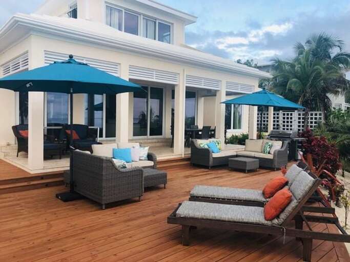 Oceanfront pool deck area furnished for lounging and dining. Oceanfront pool deck area furnished for lounging and dining.