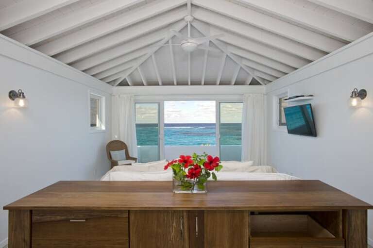 Upstairs master bedroom with balcony and vast ocean view