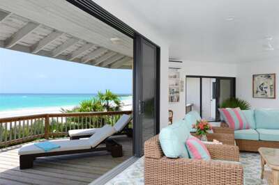 Living room with sliding glass wall to sun deck