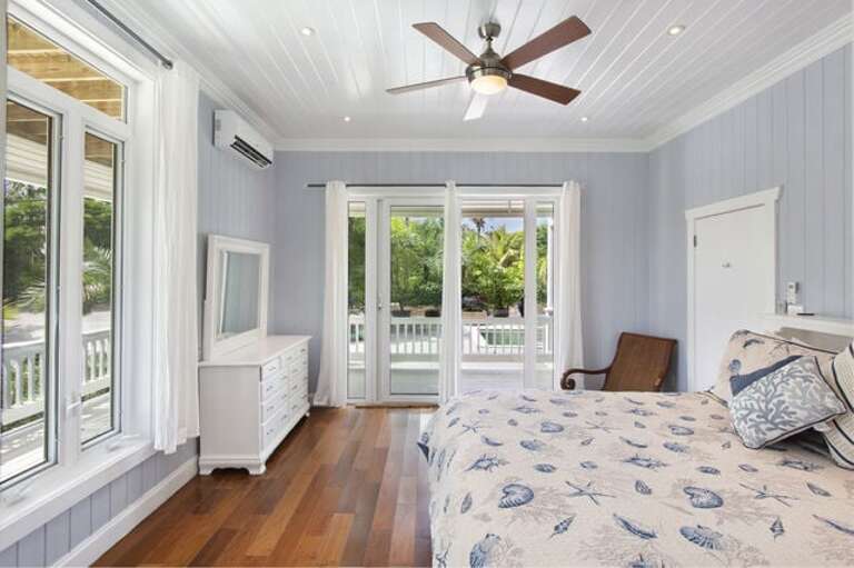 Poolside bedroom with king bed and en-suite bath.