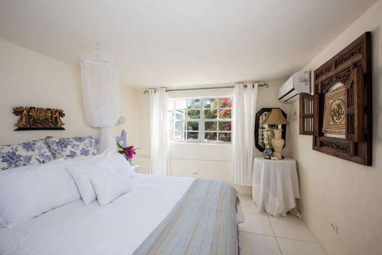 Bedroom Four with queen size bed and a twin bed.