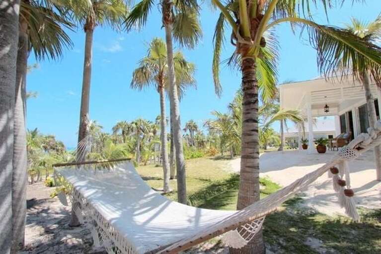 Guest Cottage 1: Patio and hammock (one of two hammocks) Guest Cottage 1: Patio and hammock (one of two hammocks)