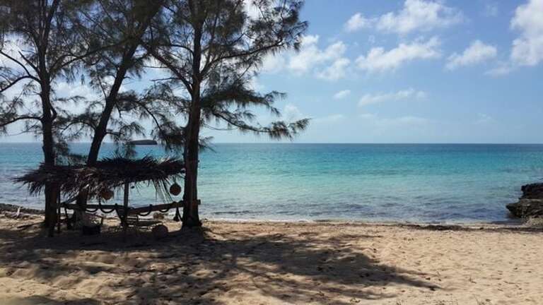 Little Bay Beach, a little beach 150 yards down the coast from Savannah Sunset House, or by land,