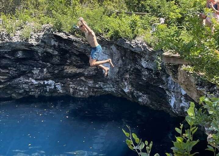 Cliff jumping at the Rock Sound Ocean Hole