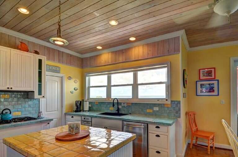 Modern fully equipped kitchen with ocean views.