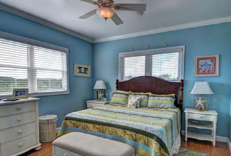 Second upstairs bedroom with king bed and en suite bath