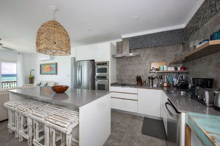 Fully equipped chefs kitchen with all modern appliances and ocean view Fully equipped chefs kitchen with all modern appliances and ocean view