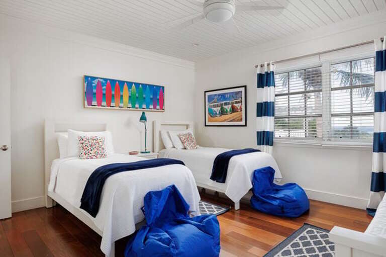 Guest bedroom has twin beds that can convert to a king.