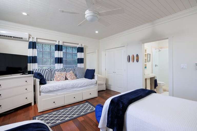 Guest bedroom with two twins that convert to a king and a day bed with trundle