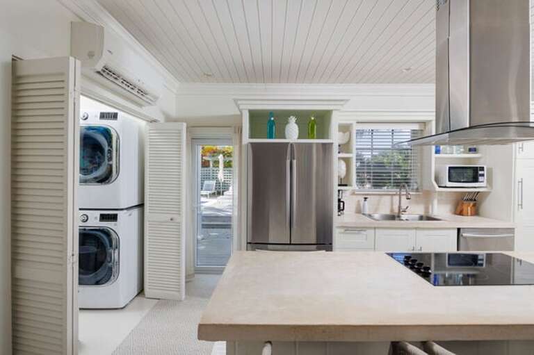There is a laundry room off the great room with a washer and dryer.