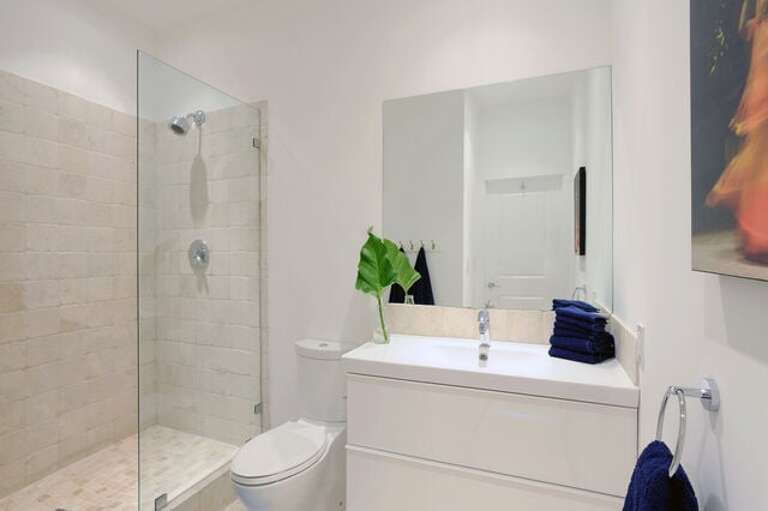 Master bath finished in tumbled marble with travertine marble floor.