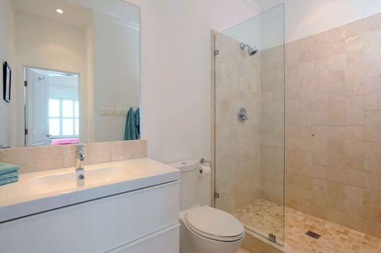 Master bath finished in tumbled marble with travertine marble floor.