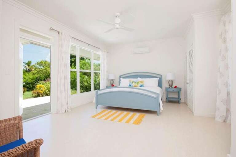 Downstairs master bedroom with en suite bath and patio.