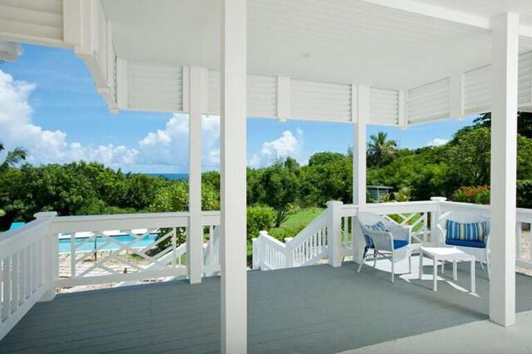 Porch overlooking pool and gardens.
