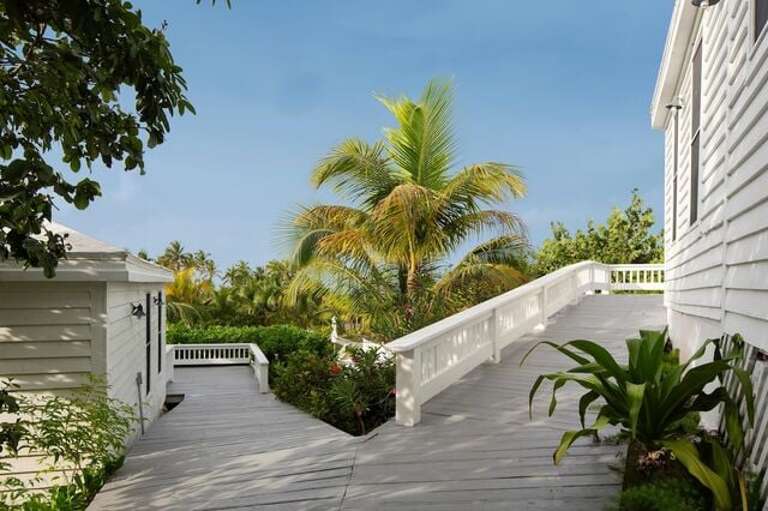 The two Beach Cottages with pool and ocean views