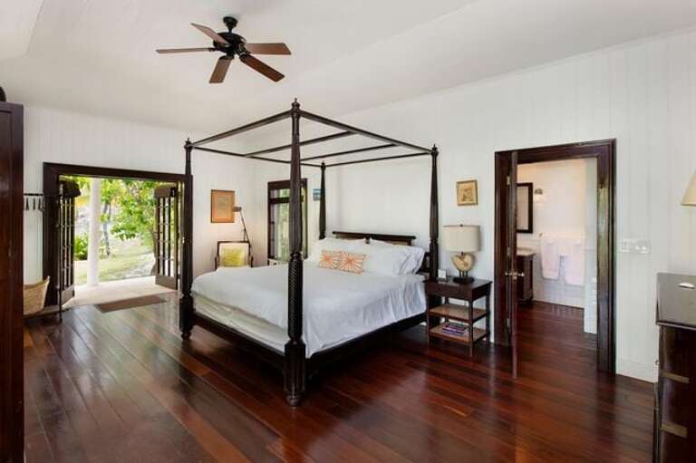 Main House master bedroom suite with king bed and en suite bath.