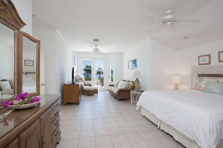 Master Bedroom with ocean views, patio, king bed, and en-suite bath Master Bedroom with ocean views, patio, king bed, and en-suite bath