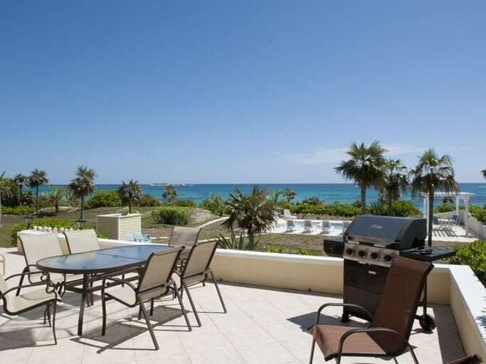 Patio overlooking beach and pool Patio overlooking beach and pool