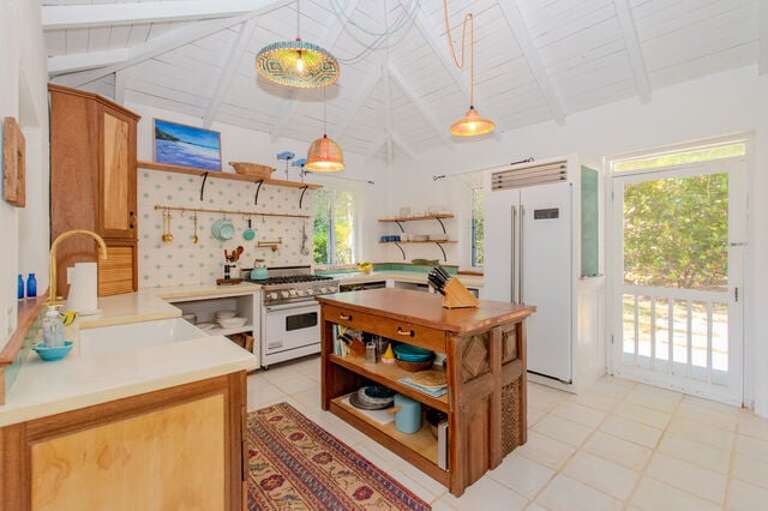 Fully equipped kitchen with new stainless steel gas range, two refrigerators, dishwasher and microwave.
