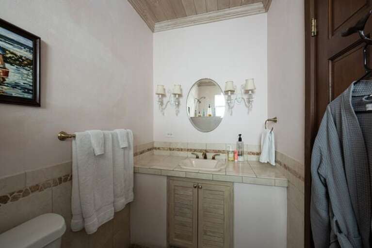 Bath with walk-in shower.