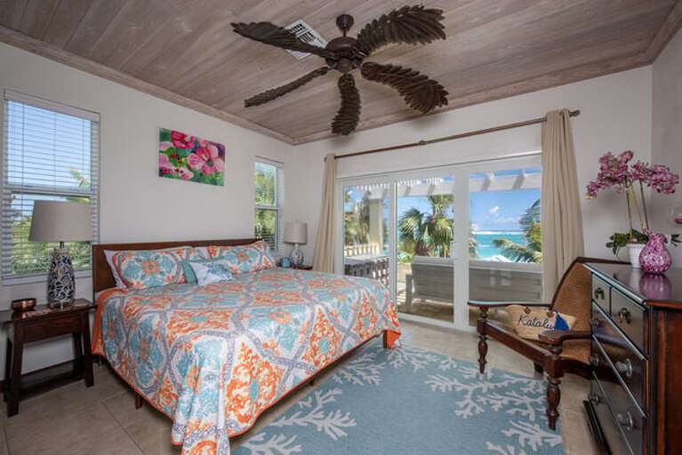 Bedroom suite #1 - king size bed with deck and beach/ocean views.