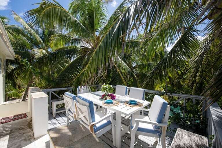 Deck off the kitchen overlooking the garden pool
