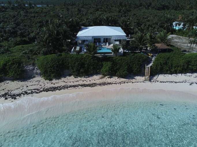 Kataluma House is a grand 6-bedroom, 6½-bath beachfront estate directly on 2-mile-long Double Bay Beach