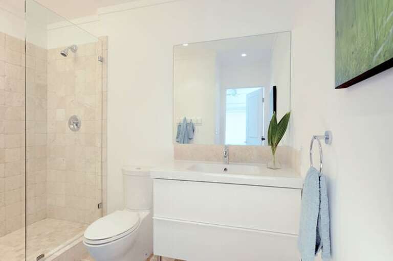Master bath finished in tumbled marble with travertine marble floor.