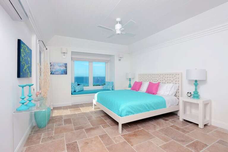 Master suite with balcony, window seat, and 50-mile ocean view.
