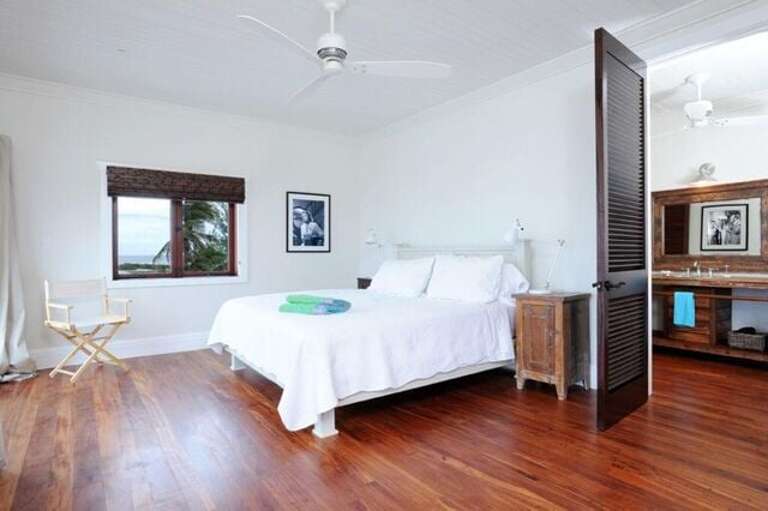 Second upstairs master suite with king bed, full en-suite bath, and ocean views