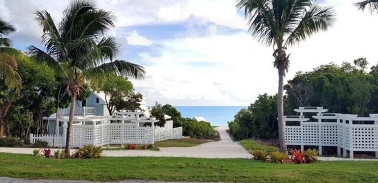 Entrance to the community with the roof of Coral Point visible in the distance.  There are only two houses in the community, and Coral Point is the only house currently in use.