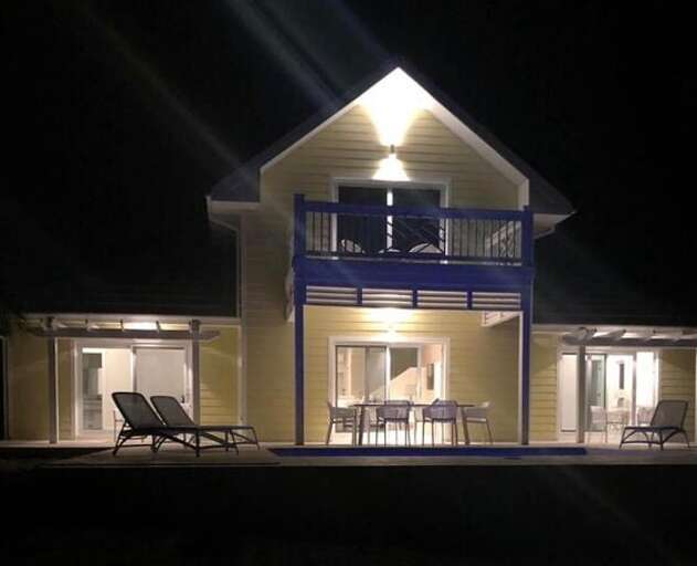 Exterior, patio, and pool at night.