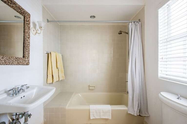 Bath with tub/shower combination.