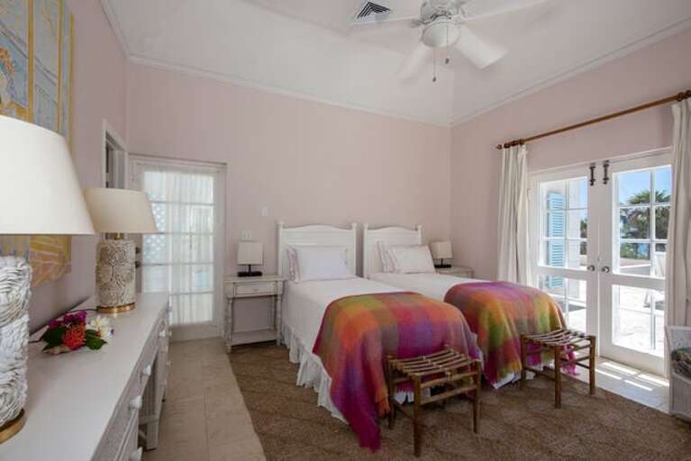 Guest bedroom suite. The twin beds can be converted to a king. Every bedroom has an en suite bath.
