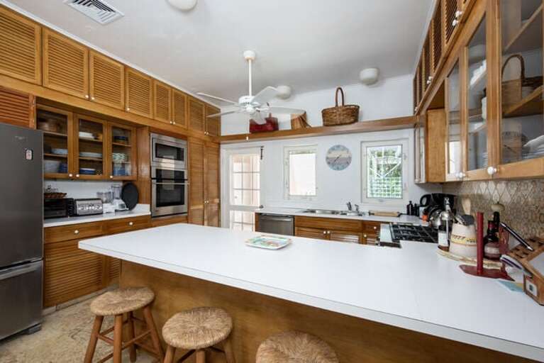 Kitchen with additional bar seating.