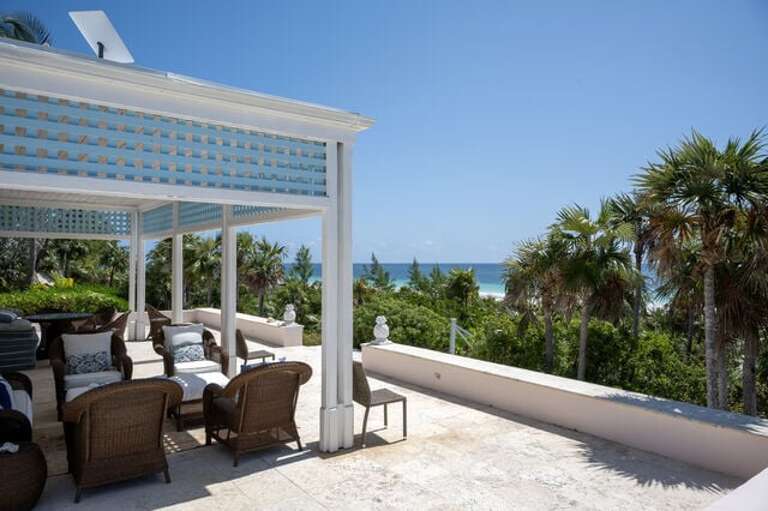 Wrap around terrace covered seating area.