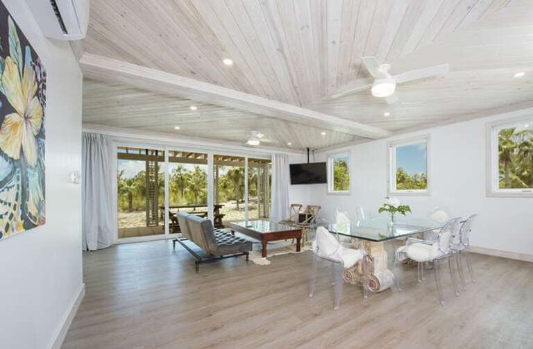 The large living and dining areas flow out to a private wrap around patio with both shaded and open areas, and a stunning in-ground pool.